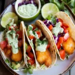 Crispy Beer Battered Baja Fish Tacos with Creamy Cilantro Sauce First Image First Image