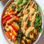 Quinoa & Roasted Vegetable Bowls with Creamy Peanut Sauce First Image First Image